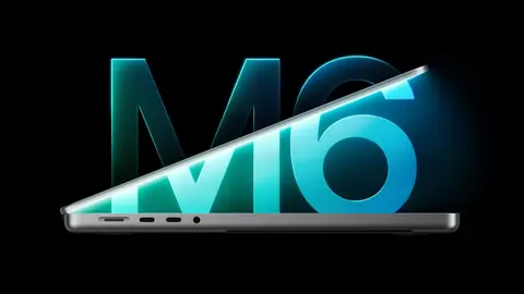 MacBook Pro cinza em fundo preto, com o chip M6 em letras de neon azul e verde ao fundo