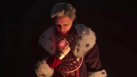 Imperador de The Elder Scrolls IV: Oblivion em manto vermelho e dourado com pele branca, segurando um pingente brilhante no peito