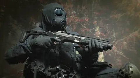 Operador com máscara de gás e roupa tática preta segura um rifle futurista em cenário avermelhado e borrado