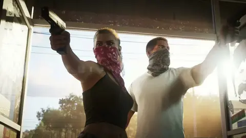 Duas personagens de GTA VI com bandanas no rosto e pistolas em punho, em cena do trailer oficial