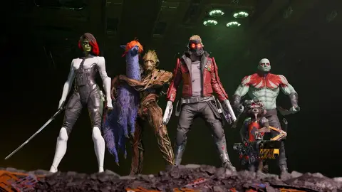 Gamora, Cosmo, Groot, Star-Lord, Drax e Rocket posam em cenário escuro e com entulho, em cena de Marvel's Guardians of the Galaxy