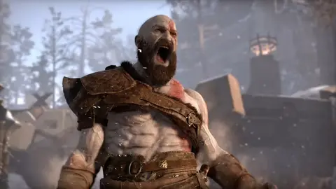 Kratos, protagonista de God of War, com barba e armadura de couro, gritando em cenário nevado com árvores ao fundo