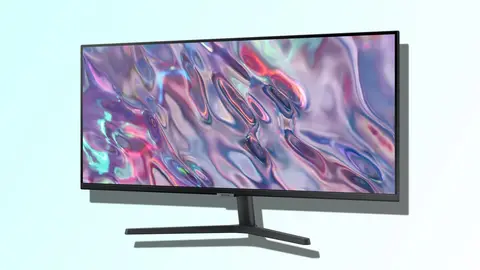 Monitor Samsung preto de tela larga exibindo papel de parede abstrato colorido, sobre fundo azul claro