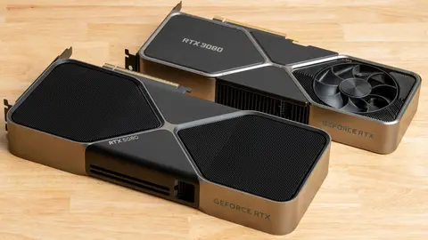 Duas placas de vídeo GeForce RTX sobre mesa de madeira: RTX 5080 em primeiro plano e RTX 3080 ao fundo