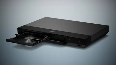 Leitor Blu-ray Sony UBP-X700 preto com a bandeja aberta e um disco dentro, sobre fundo cinza-azulado