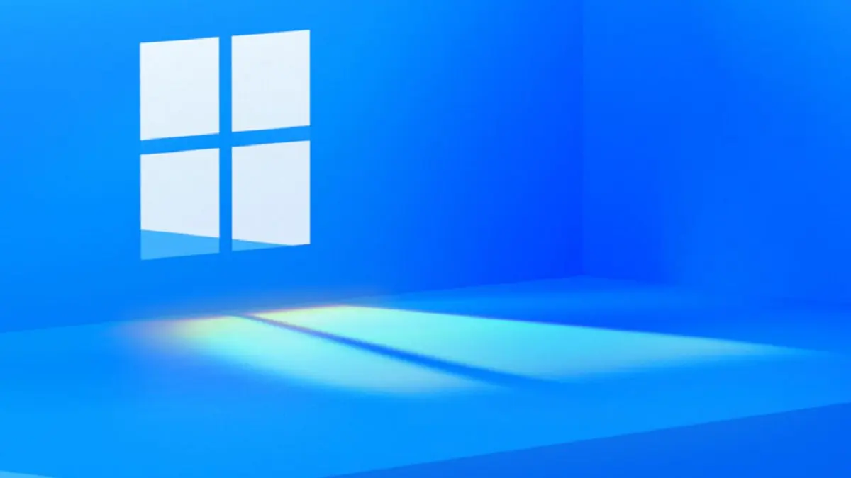 Logo do Windows em janela iluminada numa parede azul, com um feixe de luz no chão